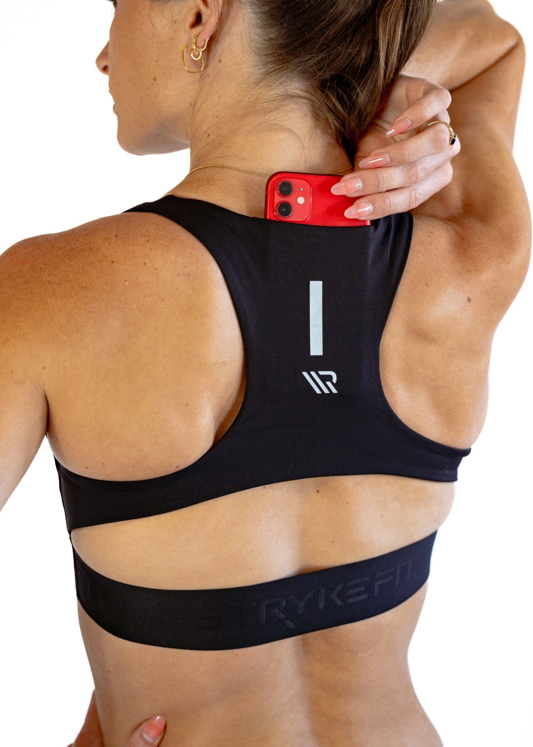 The FIT CROP TOP is designed with a back phone pocket enabling you to store your phone comfortably. Listening to music, podcasts, or even just having your phone with you for personal security is a bonus on any run. The racerback straps follow the curve of your shoulder blades to allow your arms to move freely while offering maximum support.