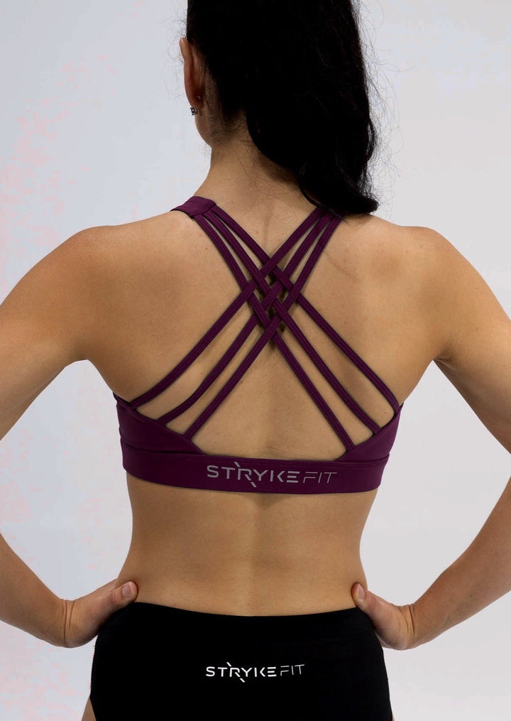 INSPIRE RUNNING CROP TOP has been designed with featured multi cross back straps. This crop top is for the girl who likes to look good while running or working out in a medium impact top. With a reflective back logo print you can be seen while running in low light.