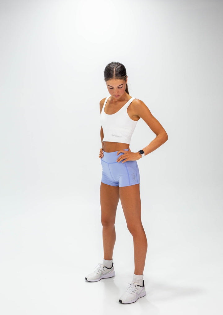 The INTERVAL CROP TOP is a longer-length crop top with a built-in bra for extra support and added coverage. Designed for high-impact training this top is a great addition to any wardrobe. Lightweight, quick-dry fabric, Moisture-wicking technology, High impact fit, Built-in shelf bra, reflective logo to enhance visibility in low light are some of the features.