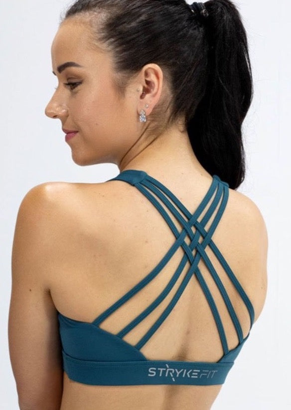 INSPIRE RUNNING CROP TOP has been designed with featured multi cross back straps. This crop top is for the girl who likes to look good while running or working out in a medium impact top. With a reflective back logo print you can be seen while running in low light.