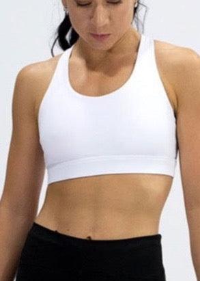 INSPIRE RUNNING CROP TOP has been designed with featured multi cross back straps. This crop top is for the girl who likes to look good while running or working out in a medium impact top. With a reflective back logo print you can be seen while running in low light.