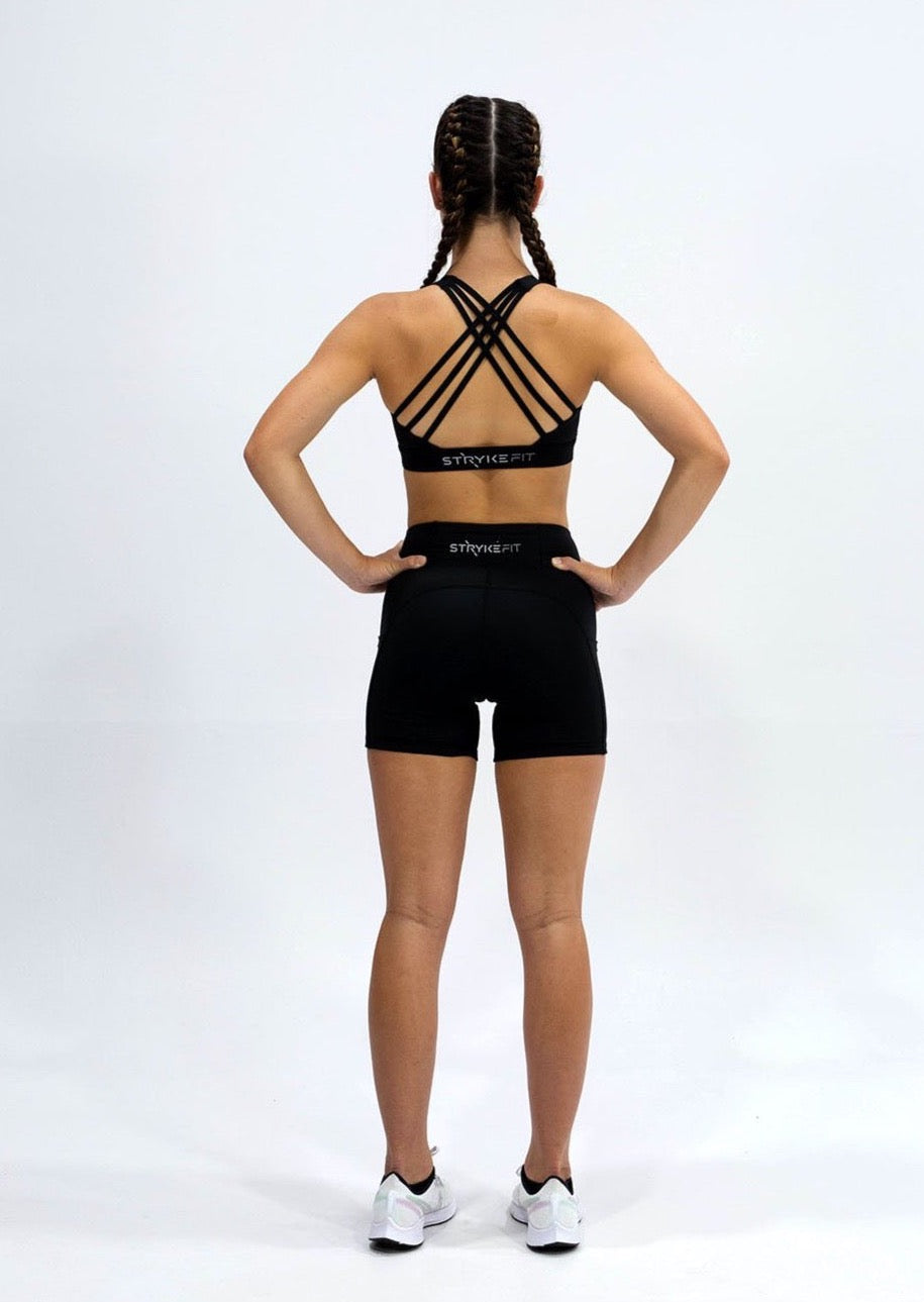 INSPIRE RUNNING CROP TOP has been designed with featured multi cross back straps. This crop top is for the girl who likes to look good while running or working out in a medium impact top. With a reflective back logo print you can be seen while running in low light.