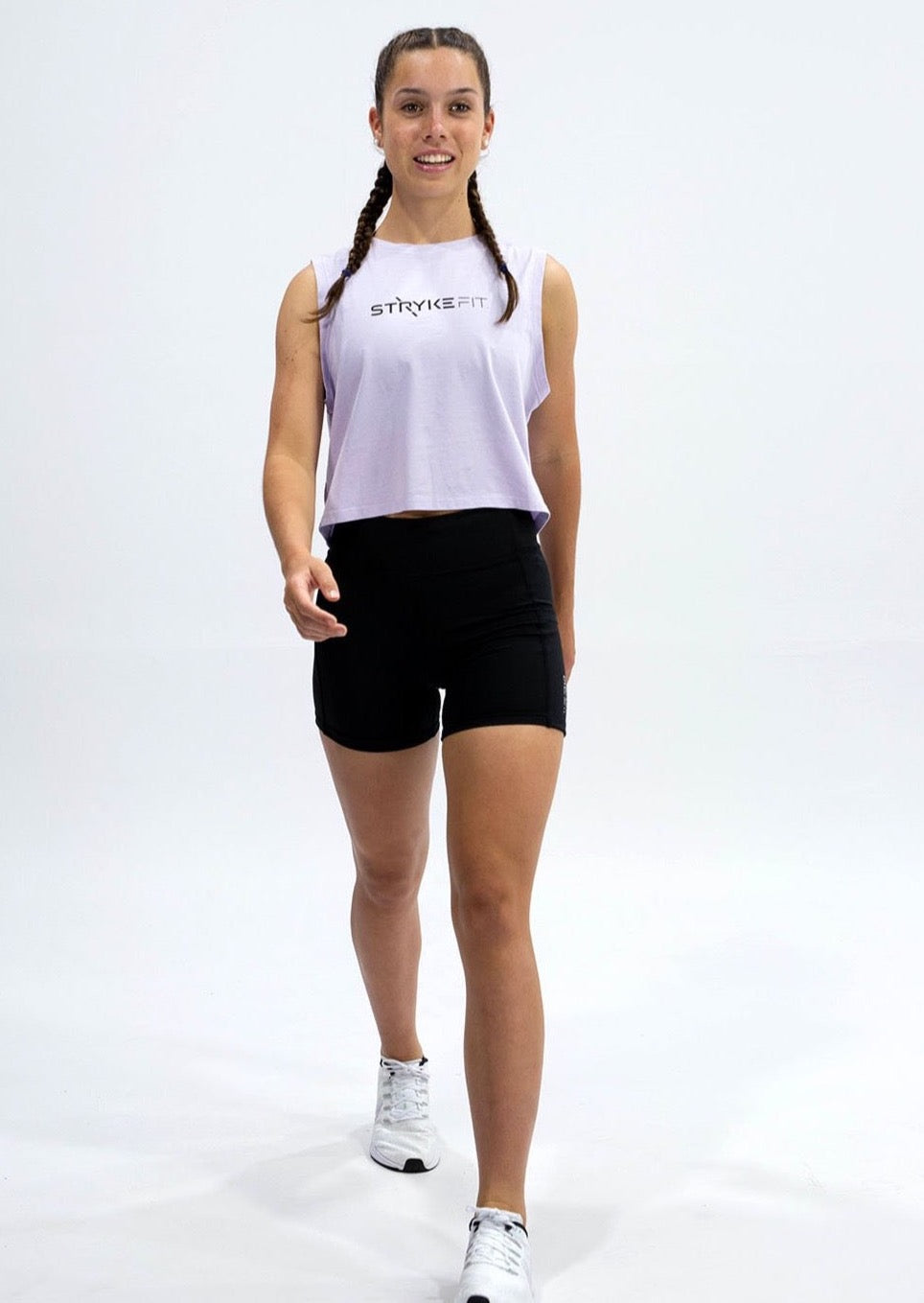 SQUAD SLEEVELESS TANK is made from a soft combed cotton jersey and featuring a crop tank style. The tank has a screenprint perfectly placed on both the front and back of the garment. Match back the SQUAD SLEEVELESS TANK with the Trek 5” Running Short and you have the perfect outfit. The SQUAD SLEEVELESS TANK is offered in Peacock Green, White, Lilac and Tangerine.