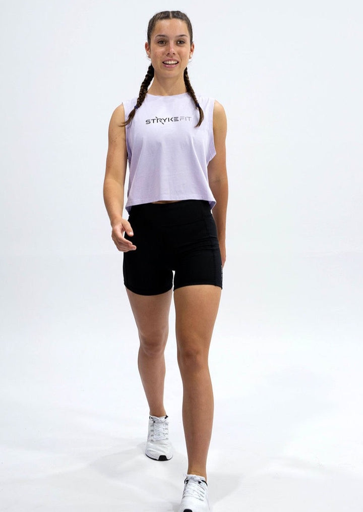 SQUAD SLEEVELESS TANK is made from a soft combed cotton jersey and featuring a crop tank style. The tank has a screenprint perfectly placed on both the front and back of the garment. Match back the SQUAD SLEEVELESS TANK with the Trek 5” Running Short and you have the perfect outfit. The SQUAD SLEEVELESS TANK is offered in Peacock Green, White, Lilac and Tangerine.