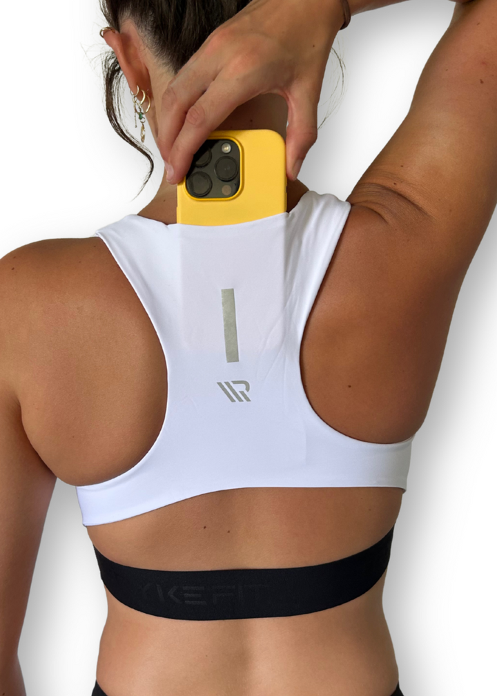 The FIT CROP TOP is designed with a back phone pocket enabling you to store your phone comfortably. Listening to music, podcasts, or even just having your phone with you for personal security is a bonus on any run. The racerback straps follow the curve of your shoulder blades to allow your arms to move freely while offering maximum support.
Lightweight, quick-dry, and breathable fabric
Moisture-wicking technology
Supportive fit
Phone pocket in racerback
Logo elastic midriff
Reflective logo to enhance visibi