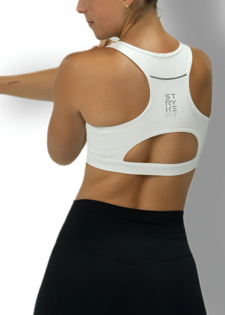 The STRYKE CROP TOP is designed with a back pocket enabling you to store your phone effortlessly, allowing you to listen to music, podcasts, or even just having it on you for personal security. The racerback straps follow the curve of your shoulder blades to allow your arms to move freely while offering maximum support.