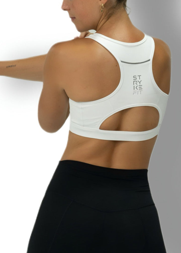 The STRYKE CROP TOP is designed with a back pocket enabling you to store your phone effortlessly, allowing you to listen to music, podcasts, or even just having it on you for personal security. The racerback straps follow the curve of your shoulder blades to allow your arms to move freely while offering maximum support.