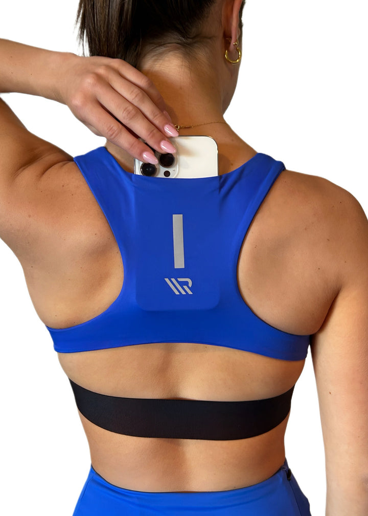 The FIT CROP TOP is your go-to for every run, with a discreet back pocket to stash your phone, gels, or any on-the-run essentials. Keep your playlist pumping, your fuel close, and your focus locked in.

The racerback design follows the natural line of your shoulders, unlocking full arm mobility while delivering uncompromising support. Lightweight, breathable, and made to move with you from the first step to the final sprint.