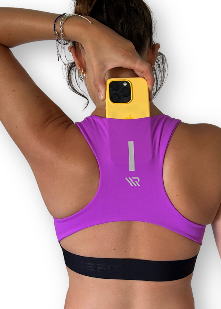 The FIT CROP TOP is designed with a back phone pocket enabling you to store your phone comfortably. Listening to music, podcasts, or even just having your phone with you for personal security is a bonus on any run. The racerback straps follow the curve of your shoulder blades to allow your arms to move freely while offering maximum support.
Lightweight, quick-dry, and breathable fabric
Moisture-wicking technology
Supportive fit
Phone pocket in racerback
Logo elastic midriff
Reflective logo to enhance visibi