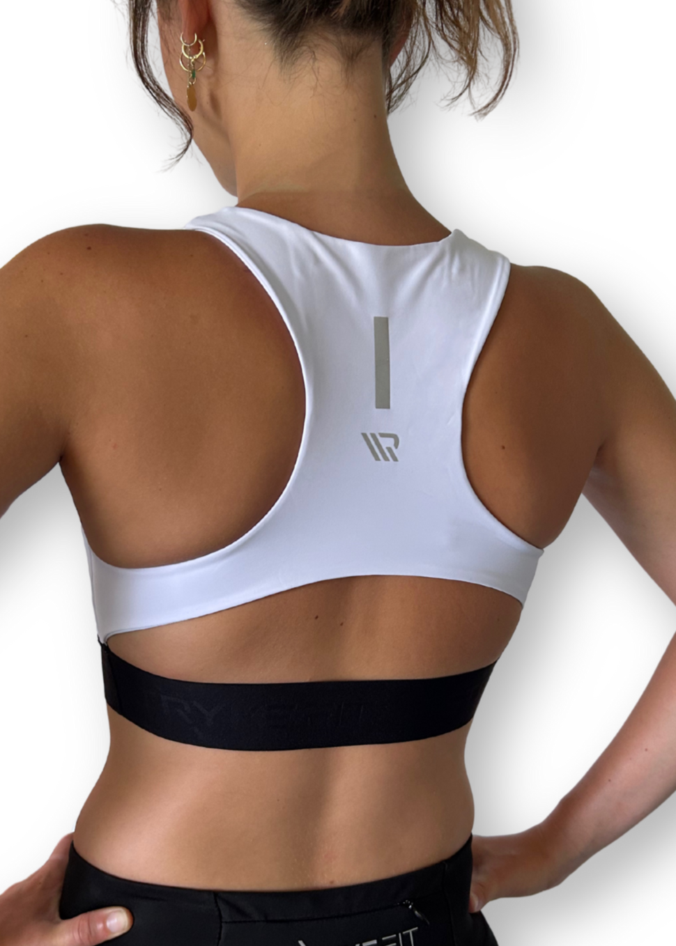 The FIT CROP TOP is designed with a back phone pocket enabling you to store your phone comfortably. Listening to music, podcasts, or even just having your phone with you for personal security is a bonus on any run. The racerback straps follow the curve of your shoulder blades to allow your arms to move freely while offering maximum support.
Lightweight, quick-dry, and breathable fabric
Moisture-wicking technology
Supportive fit
Phone pocket in racerback
Logo elastic midriff
Reflective logo to enhance visibi