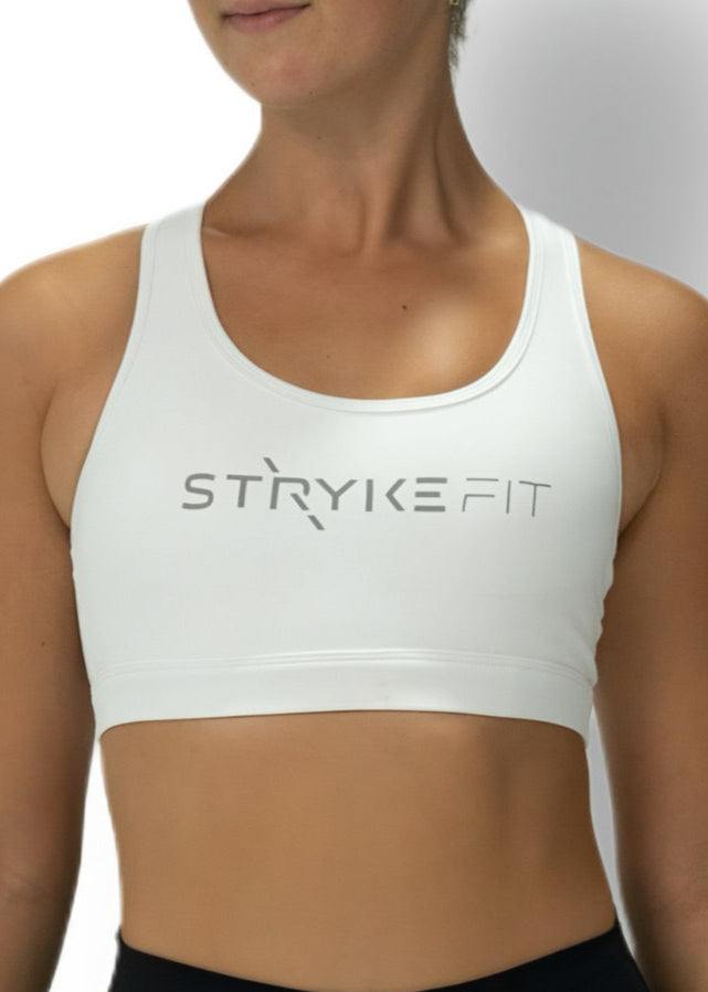 The STRYKE CROP TOP is designed with a back pocket enabling you to store your phone effortlessly, allowing you to listen to music, podcasts, or even just having it on you for personal security. The racerback straps follow the curve of your shoulder blades to allow your arms to move freely while offering maximum support.