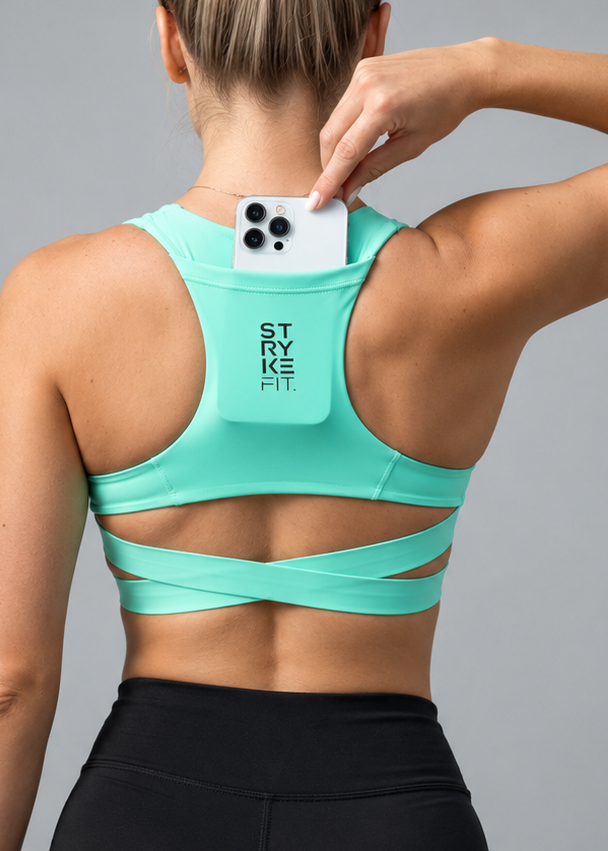The ATHLETE CROP TOP features a discrete back pocket, keeping your essentials close, whether it's your phone, gels, keys, or anything you need to go the distance without distractions.

The performance racerback design follows the natural line of your shoulders, allowing unrestricted movement and complete freedom through every stride. Engineered for support without compromising comfort, it delivers a secure fit that moves with your body on every run.