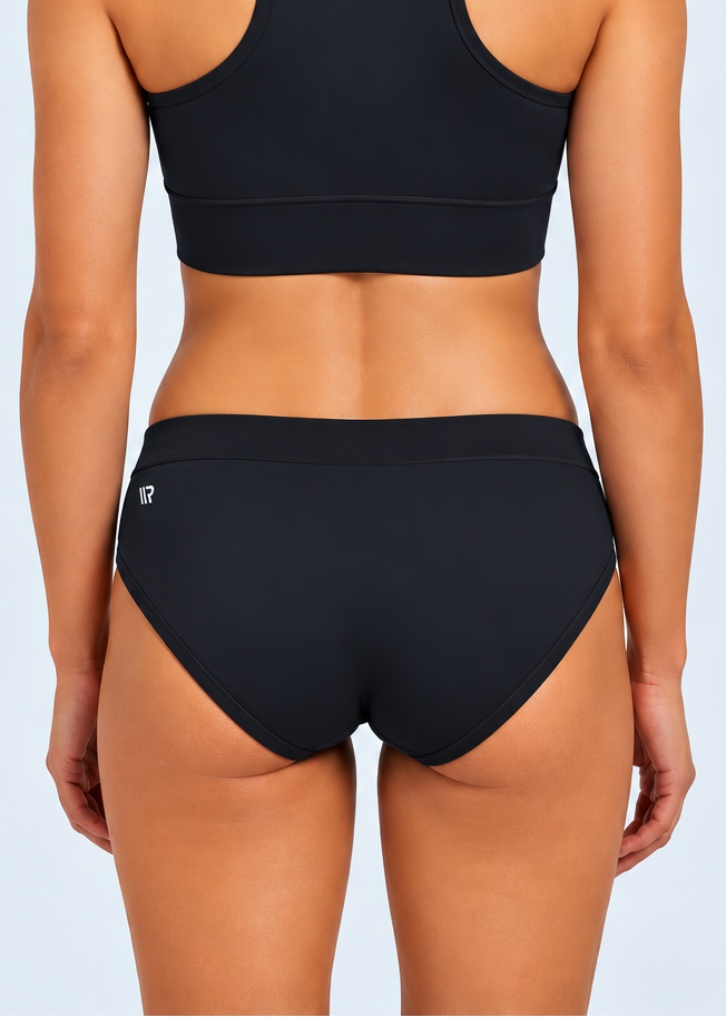 The ENERGY RUNNING BRIEFS are for athletes that want to take their performance to the next level. Engineered for speed and built for peak performance, these briefs will give you the ultimate edge on race day.A woman modeling racing briefs in a purple and dark purple striped pattern with gold 'STRYKEFIT' branding.