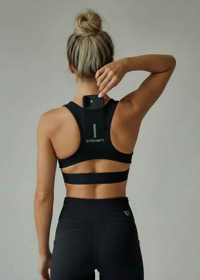 Person wearing a black sports bra and leggings with a visible brand logo on a plain background.

The FIT 2.0 CROP TOP is a new version of our most popular style, this crop has a discreet back pocket to stash your phone, gels, or any running essentials.&nbsp;

The racerback design follows the natural line of your shoulders, unlocking full arm mobility while delivering uncompromising support. Lightweight, breathable, and made to move with you fr