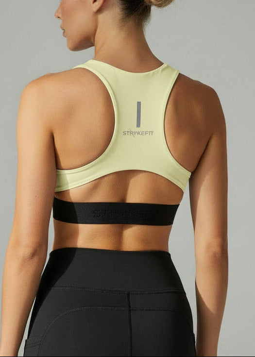 Woman wearing a light green sports bra and black shorts on a gray background.
The FIT 2.0 CROP TOP is a new version of our most popular style, this crop has a discreet back pocket to stash your phone, gels, or any running essentials.&nbsp;

The racerback design follows the natural line of your shoulders, unlocking full arm mobility while delivering uncompromising support. Lightweight, breathable, and made to move with you from the first step to the final sprint.