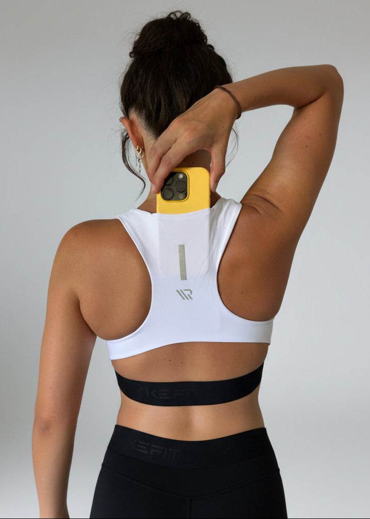 FIT CROP TOP

The FIT CROP TOP is your go-to for every run, with a discreet back pocket to stash your phone, gels, or any running essentials.

The racerback design follows the natural line of your shoulders, unlocking full arm mobility while delivering uncompromising support. Lightweight, breathable, and made to move with you from the first step to the final sprint.