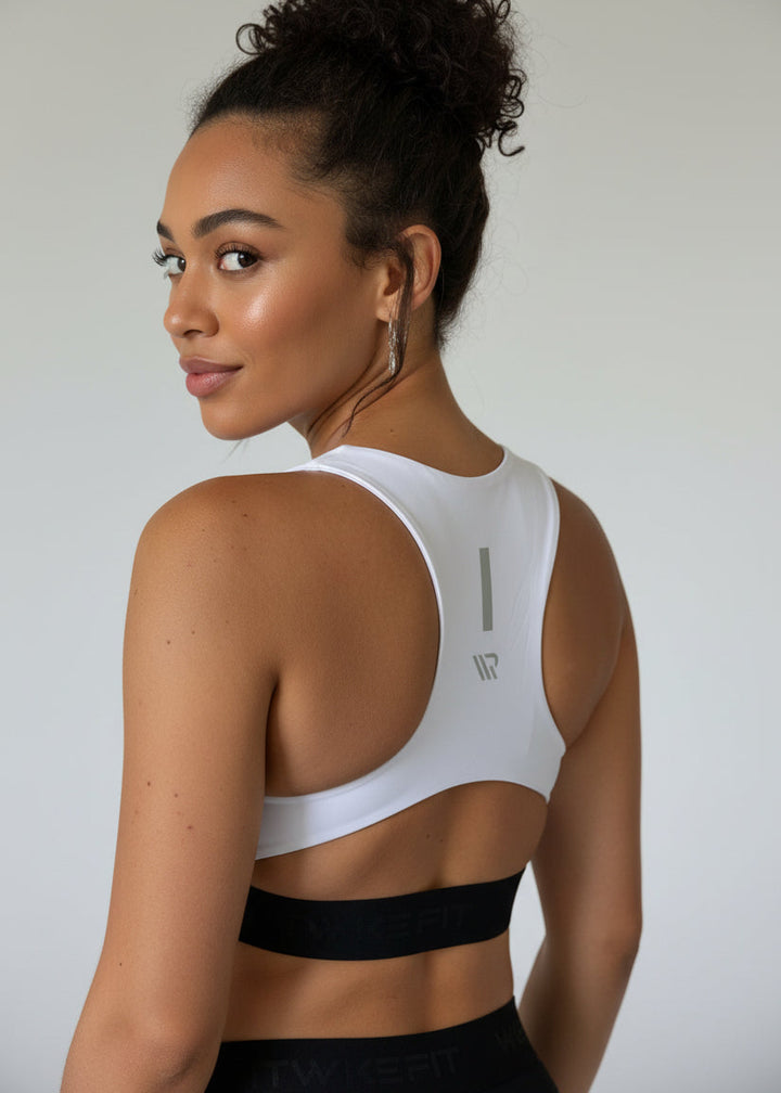FIT CROP TOP

The FIT CROP TOP is your go-to for every run, with a discreet back pocket to stash your phone, gels, or any running essentials.

The racerback design follows the natural line of your shoulders, unlocking full arm mobility while delivering uncompromising support. Lightweight, breathable, and made to move with you from the first step to the final sprint.