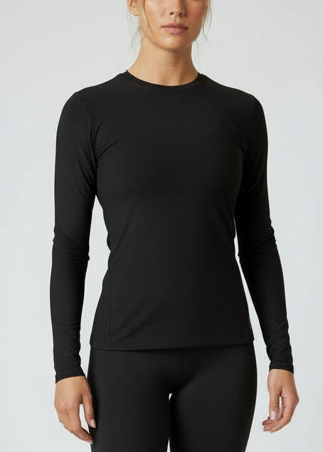 Woman wearing a black long-sleeve top against a gray background.
Engineered for movement, built for comfort — the IGNITE LS TOP is your go-to layer for any run. Whether you're warming up, or layering post-run, this is the perfect top

Made from ultra-soft, Nylon fabric, it offers just the right amount of warmth and support without sacrificing breathability.