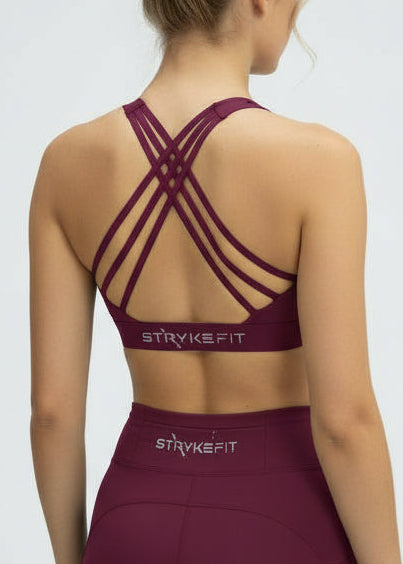 Woman wearing a burgundy sports bra and shorts set with 'STRIVE FIT' branding on a light gray background.
The Inspire Crop Top features a flattering silhouette with multiple back straps that allow natural movement while maintaining a comfortable, supportive feel.

Easy to wear and effortless on the run, this crop is built for training days of all kinds — from steady sessions to higher-intensity efforts. Lightweight and functional, it will soon become you favourite crop.