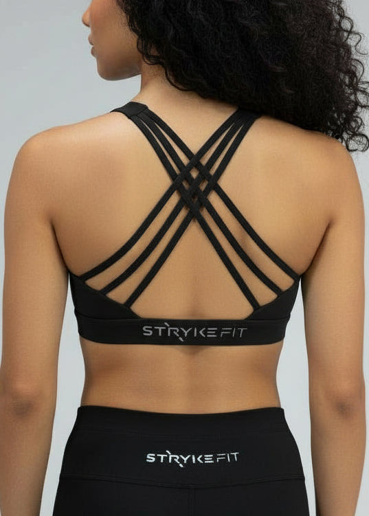 Woman wearing a black sports outfit with 'STRIVE FIT' branding on a white background.
The Inspire Crop Top features a flattering silhouette with multiple back straps that allow natural movement while maintaining a comfortable, supportive feel.

Easy to wear and effortless on the run, this crop is built for training days of all kinds — from steady sessions to higher-intensity efforts. Lightweight and functional, it will soon become you favourite crop.