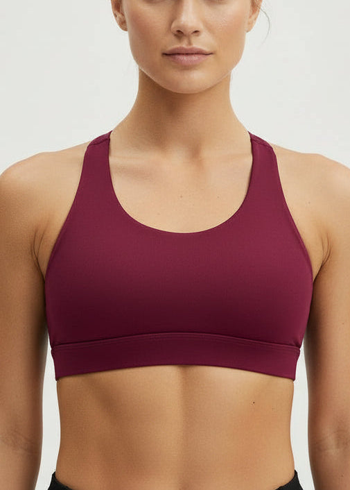 Woman wearing a burgundy sports bra and shorts set with 'STRIVE FIT' branding on a light gray background.
The Inspire Crop Top features a flattering silhouette with multiple back straps that allow natural movement while maintaining a comfortable, supportive feel.

Easy to wear and effortless on the run, this crop is built for training days of all kinds — from steady sessions to higher-intensity efforts. Lightweight and functional, it will soon become you favourite crop.