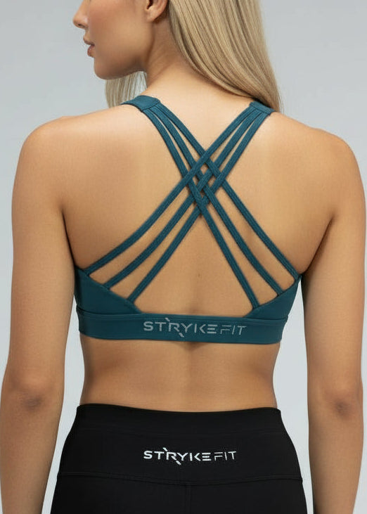 Woman wearing a teal sports bra and leggings on a gray background.
The Inspire Crop Top features a flattering silhouette with multiple back straps that allow natural movement while maintaining a comfortable, supportive feel.

Easy to wear and effortless on the run, this crop is built for training days of all kinds — from steady sessions to higher-intensity efforts. Lightweight and functional, it will soon become you favourite crop.