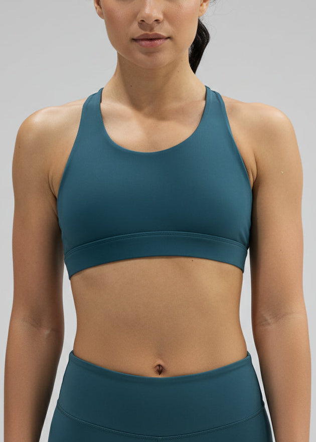 Woman wearing a teal sports bra and leggings on a gray background.
The Inspire Crop Top features a flattering silhouette with multiple back straps that allow natural movement while maintaining a comfortable, supportive feel.

Easy to wear and effortless on the run, this crop is built for training days of all kinds — from steady sessions to higher-intensity efforts. Lightweight and functional, it will soon become you favourite crop.
