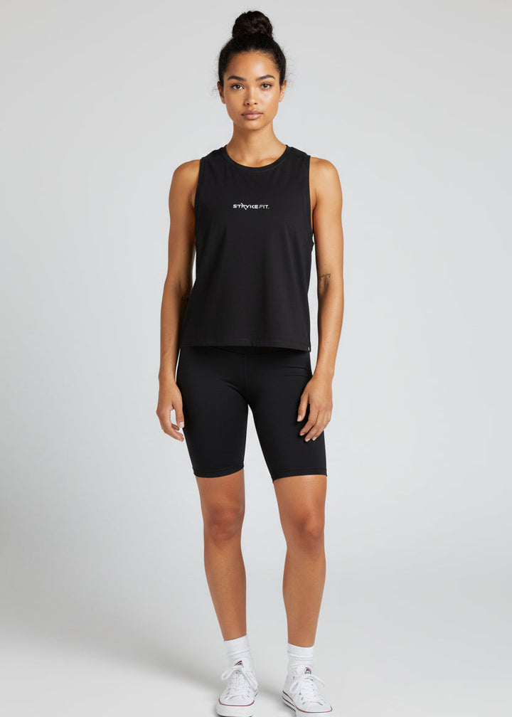 Woman wearing a black tank top and shorts with 'STRYKE FIT' logo on a light gray background.
The Jogging Singlet is made for runners who value comfort and consistency.

A dependable style you can throw on and trust for everyday runs, training sessions, and the miles in between.