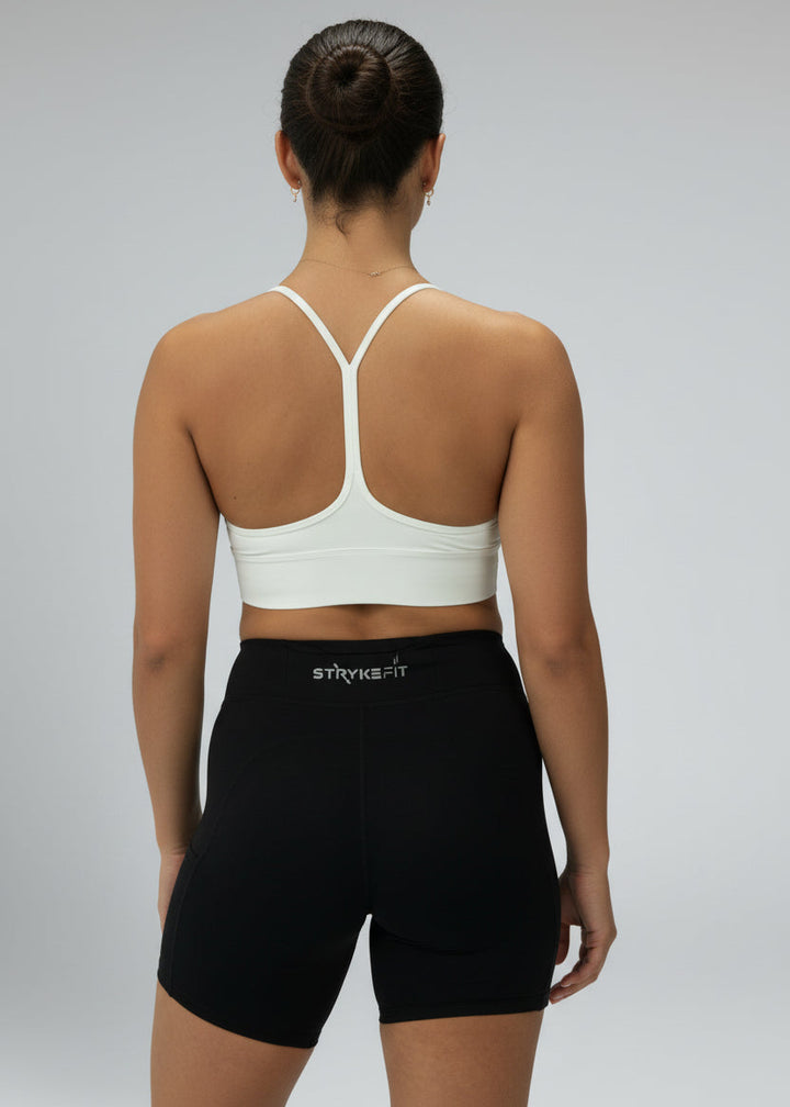 Person wearing a white sports bra and black shorts on a gray background



The PACE 7" RUN SHORT is the ultimate staple piece for runners of all levels. These shorts are made from lightweight fabric and are designed for comfort, support, and exceptional mobility. With the added convenience of leg pockets, you can carry your phone effortlessly without any distractions.