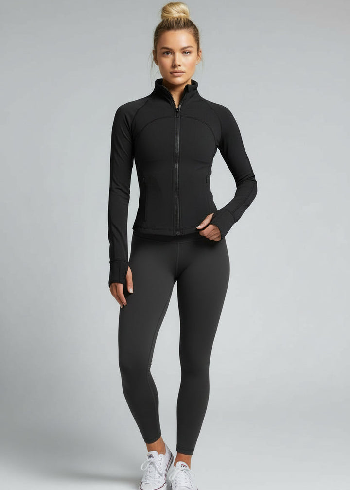 Woman wearing a black athletic jacket and leggings on a gray background.
Engineered for movement, built for comfort — the Strydeform Zip Through Jacket is your go-to layer for any run, with a slimline fit that contours without restricting movement. Whether you're warming up, layering post-run, or pushing through a chilly morning session, it's got you covered.

Made from ultra-soft, compressive fabric, it offers just the right amount of warmth and support without sacrificing breathability.