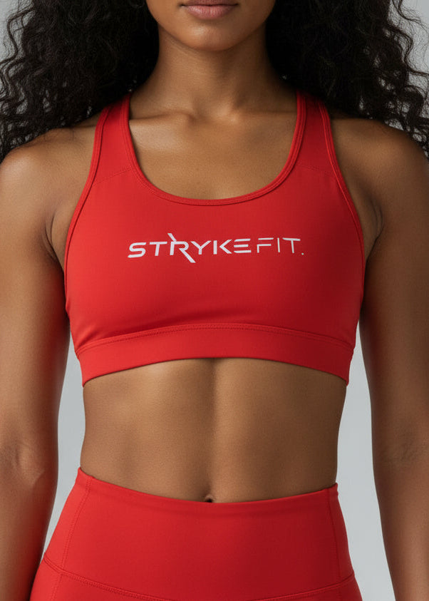 Built to move when you do.

The STRYKE Crop Top is engineered for runners who don’t want distractions — just performance.
Designed with a functional back pocket to carry your phone, gels or essentials on any run. The racerback design mirrors the natural movement of your shoulder blades, allowing unrestricted arm movement while delivering support where it counts.
