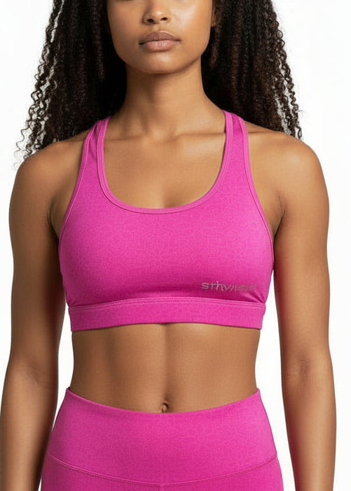 The STRYKE Crop Top is engineered for runners who don’t want distractions — just performance.

Designed with a functional back pocket to carry your phone, gels or essentials on any run. The racerback design mirrors the natural movement of your shoulder blades, allowing unrestricted arm movement while delivering support where it counts.