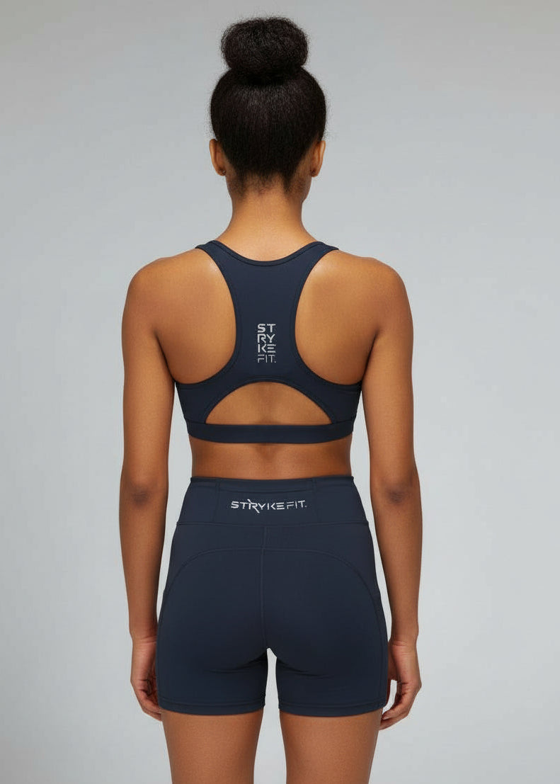 Built to move when you do.

The STRYKE Crop Top is engineered for runners who don’t want distractions — just performance.
Designed with a functional back pocket to carry your phone, gels or essentials on any run. The racerback design mirrors the natural movement of your shoulder blades, allowing unrestricted arm movement while delivering support where it counts.
