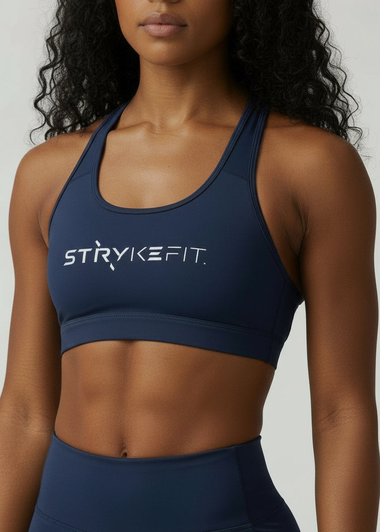 Built to move when you do.


The STRYKE Crop Top is engineered for runners who don’t want distractions — just performance.

Designed with a functional back pocket to carry your phone, gels or essentials on any run. The racerback design mirrors the natural movement of your shoulder blades, allowing unrestricted arm movement while delivering support where it counts.
