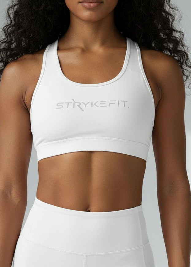 Built to move when you do.

The STRYKE Crop Top is engineered for runners who don’t want distractions — just performance.
Designed with a functional back pocket to carry your phone, gels or essentials on any run. The racerback design mirrors the natural movement of your shoulder blades, allowing unrestricted arm movement while delivering support where it counts.

