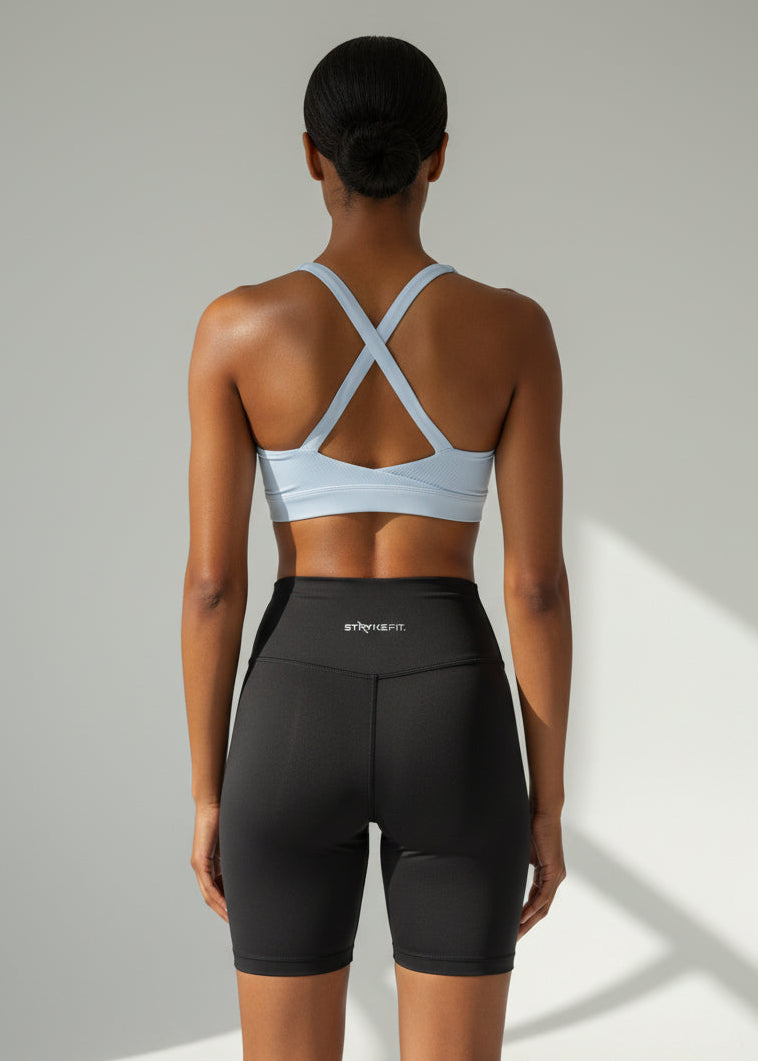 Woman wearing a light blue sports bra and black high-waisted shorts on a plain background. The ZERO 6” SHORT is the ultimate staple piece for runners of all levels. These shorts are made from lightweight fabric and are designed for comfort and exceptional mobility. With seamless sides, front, waist and leg hem, these shorts are design to feel ultra light weight and give no you distractions.

Lightweight, quick-dry, and breathable fabric
Moisture-wicking technology
Reflective logo to enhance 