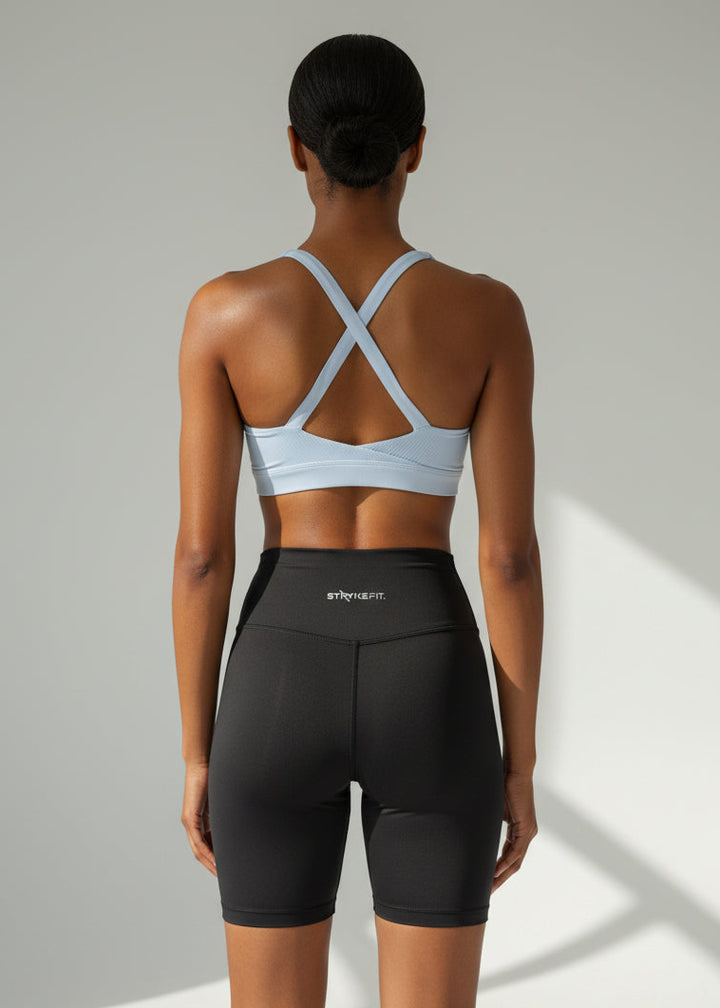 Woman wearing a light blue sports bra and black high-waisted shorts on a plain background. The ZERO 6” SHORT is the ultimate staple piece for runners of all levels. These shorts are made from lightweight fabric and are designed for comfort and exceptional mobility. With seamless sides, front, waist and leg hem, these shorts are design to feel ultra light weight and give no you distractions.

Lightweight, quick-dry, and breathable fabric
Moisture-wicking technology
Reflective logo to enhance 