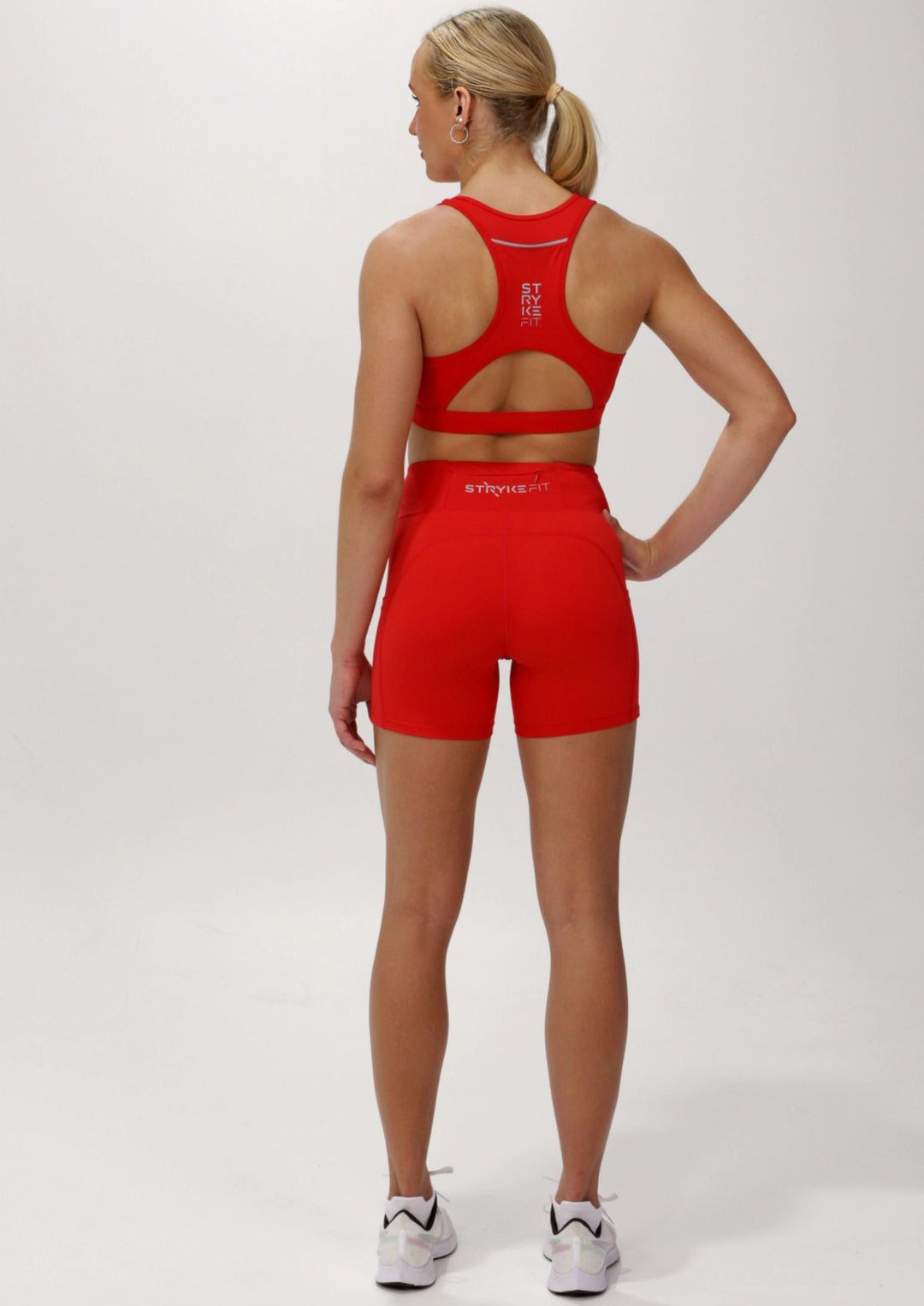 The STRYKE CROP TOP is designed with a back phone pocket enabling you to store your phone effortlessly while wearing, allowing you to listen to music, podcasts, or even just having your phone with you for personal security. The racerback straps follow the curve of your shoulder blades to allow your arms to move freely while offering maximum support. Best running crop top.