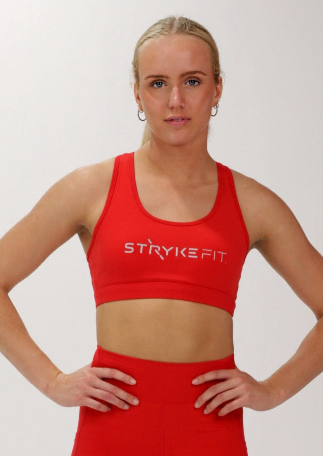 The STRYKE CROP TOP is designed with a back phone pocket enabling you to store your phone effortlessly while wearing, allowing you to listen to music, podcasts, or even just having your phone with you for personal security. The racerback straps follow the curve of your shoulder blades to allow your arms to move freely while offering maximum support. Best running crop top.