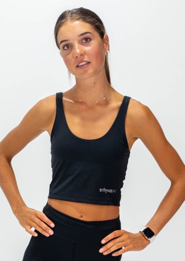 The INTERVAL CROP TOP is a longer-length crop top with a built-in bra for extra support and added coverage. Designed for high-impact training this top is a great addition to any wardrobe. Lightweight, quick-dry fabric, Moisture-wicking technology, High impact fit, Built-in shelf bra, reflective logo to enhance visibility in low light are some of the features.