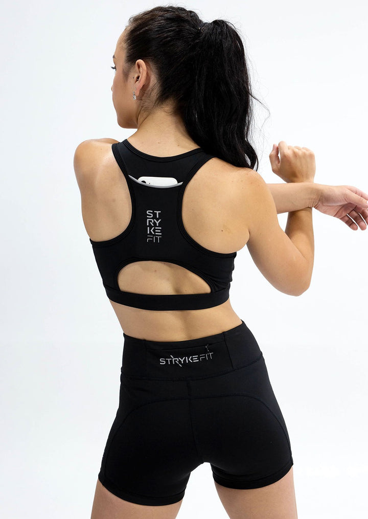 The STRYKE RUNNING CROP TOP is designed with a back phone pocket enabling you to carry your phone effortlessly while wearing, allowing you to listen to music, podcasts, or even just having it on you for personal security. The racerback straps follow the curve of your shoulder blades to allow your arms to move freely while offering maximum support. Once you run in this crop top you won't be able to live without it.