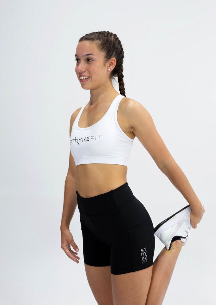 The STRYKE RUNNING CROP TOP is designed with a back phone pocket enabling you to carry your phone effortlessly while wearing, allowing you to listen to music, podcasts, or even just having it on you for personal security. The racerback straps follow the curve of your shoulder blades to allow your arms to move freely while offering maximum support. The STRYKE RUN CROP TOP is the perfect staple for any runners wardrobe.