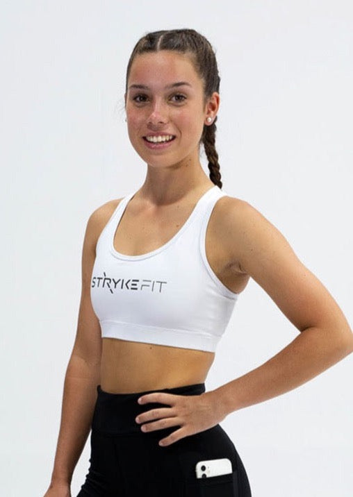 The STRYKE RUNNING CROP TOP is designed with a back phone pocket enabling you to carry your phone effortlessly while wearing, allowing you to listen to music, podcasts, or even just having it on you for personal security. The racerback straps follow the curve of your shoulder blades to allow your arms to move freely while offering maximum support. The STRYKE RUN CROP TOP is made from quick-dry, and breathable fabric with moisture-wicking technology, perfect staple for any athlete.