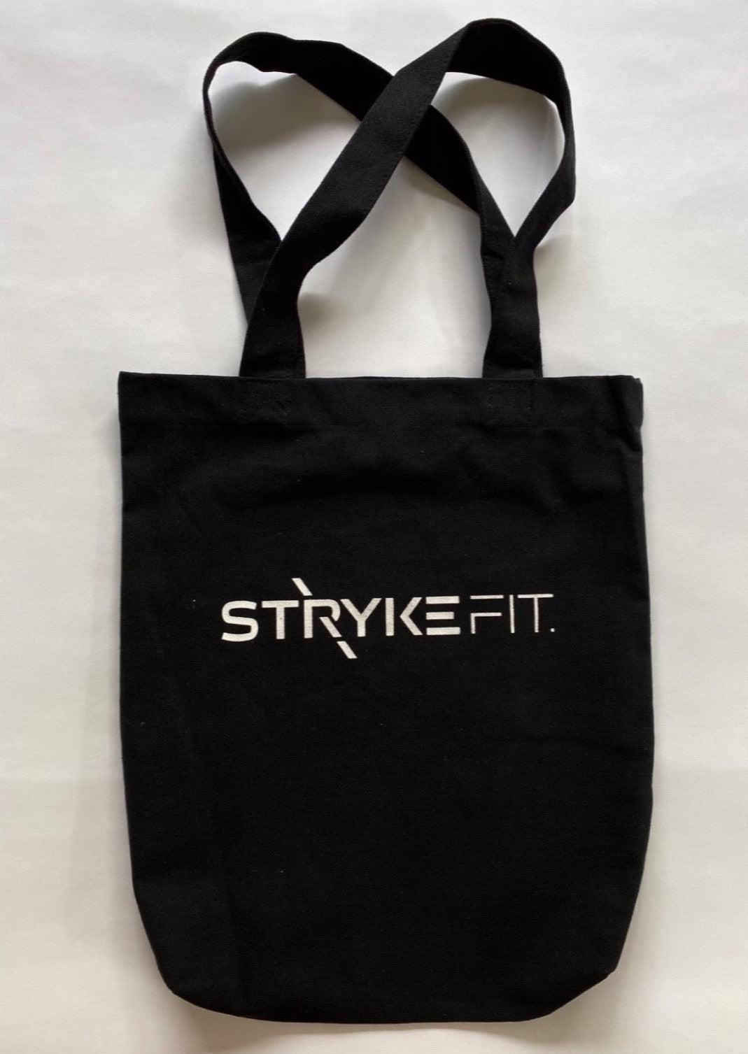 RUN FIT TOTE BAG is the perfect tote to carry your gear. Made from recycled heavy canvas fabric and featuring double long straps this will be your next favorite tote bag