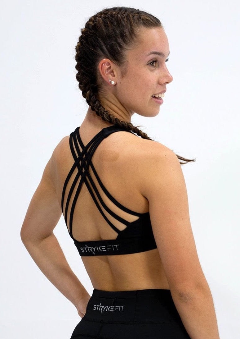 INSPIRE RUNNING CROP TOP has been designed with featured multi cross back straps. This crop top is for the girl who likes to look good while running or working out in a medium impact top. With a reflective back logo print you can be seen while running in low light.